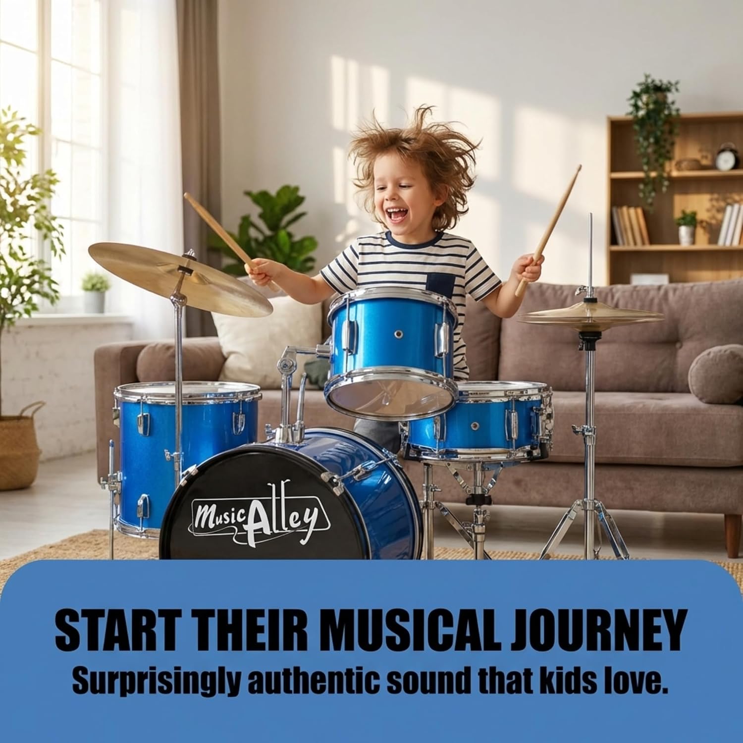 Young child enjoying playing a blue junior acoustic drum kit at home